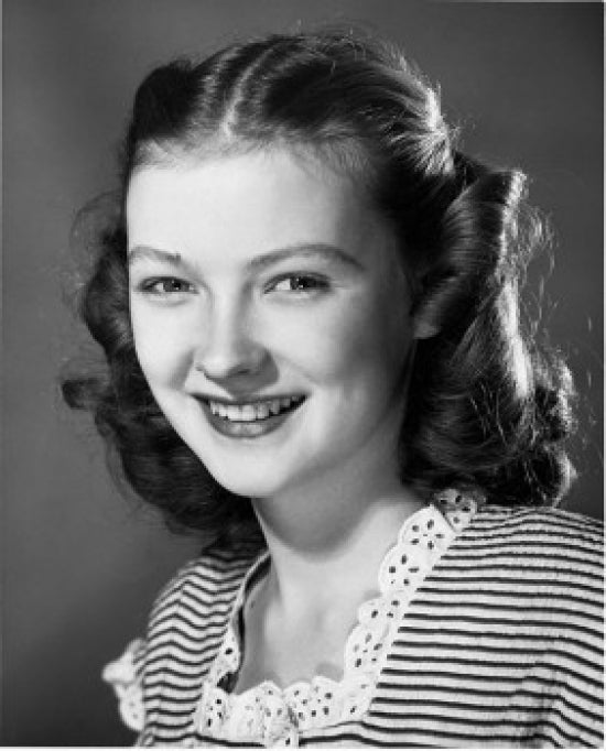 Portrait of a Teenage Girl Smiling Poster Print showcasing youthful joy.