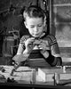 Boy repairing a model airplane poster print