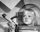 Poster of a boy in a space helmet holding a blaster