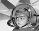 Close-up poster of a boy wearing a space helmet, colorful and inspiring.