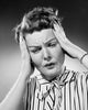 Close-up poster print of a woman suffering from a headache