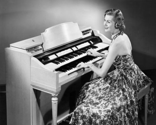 Side profile of a young woman playing an organ poster print.