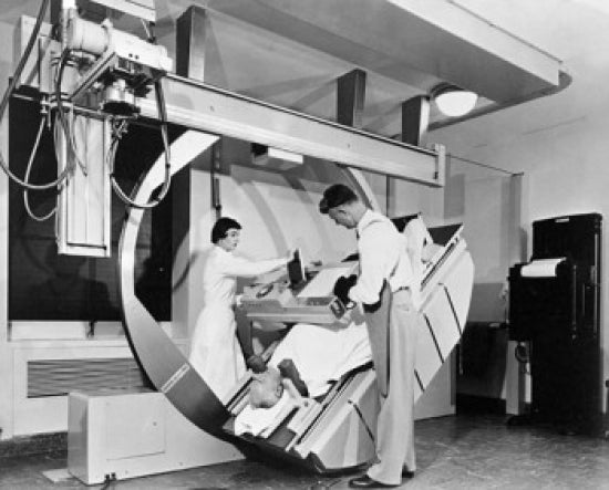 Poster print of male and female radiologists taking an x-ray of a patient.