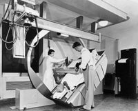 Poster print of male and female radiologists taking an x-ray of a patient.