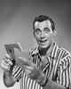 Close-up poster print of a young man holding a bankbook and envelope.