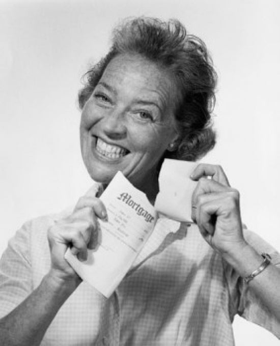 Portrait of a mid adult woman tearing a mortgage document poster print.