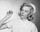 Female Nurse Reading a Thermometer Poster Print