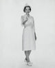 Portrait of a female nurse pointing poster print showcasing dedication to healthcare.
