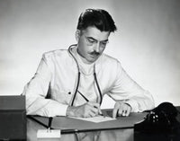 Close-up photo of a male doctor writing on paper, perfect for medical decor.
