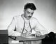 Close-up photo of a male doctor writing on paper, perfect for medical decor.