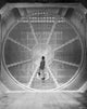 Man in a Wind Tunnel Poster Print showcasing dynamic flight energy.