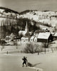 High angle view of a man pulling a Christmas tree in snow-covered landscape poster print.