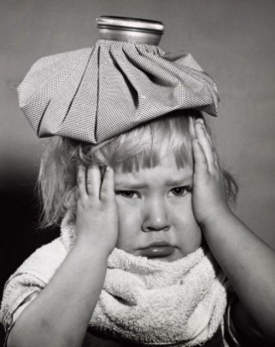 Close-up of a child suffering from a headache poster print.