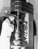 Poster print of a scientist using an electron microscope at Cavendish Laboratory, Cambridge University.