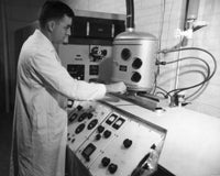 Side profile of a scientist working in General Electric Laboratory poster print.