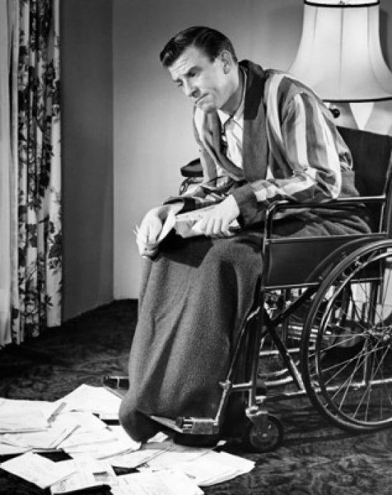 Mature man in a wheelchair deep in thought poster print