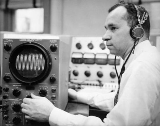 Side profile of a mid adult man operating an oscillograph poster print