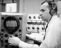 Side profile of a mid adult man operating an oscillograph poster print