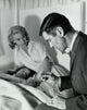 Male Doctor Reading a Thermometer Poster Print for medical decor.