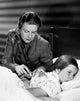 Female doctor examining a girl poster print.