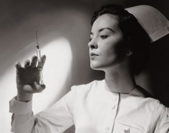 Close-up of a female nurse holding a syringe poster print.