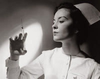 Close-up of a female nurse holding a syringe poster print.