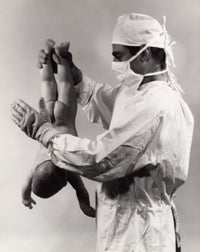 Male Doctor Spanking Newborn Baby Poster Print showcasing humor in medical art.