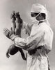 Male Doctor Spanking Newborn Baby Poster Print showcasing humor in medical art.
