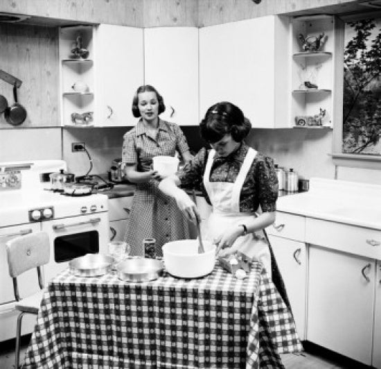 Poster of two teenage girls preparing food in the kitchen, vibrant colors.