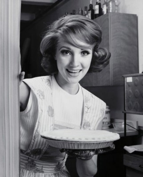 Portrait of a young woman holding an apple pie poster print.