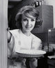 Portrait of a young woman holding an apple pie poster print.