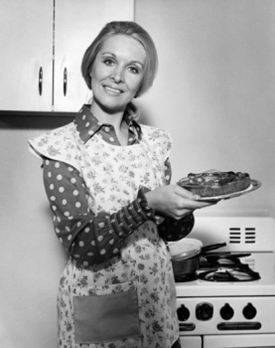 Charming poster of a mature woman smiling and holding a plate of food.