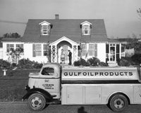 Fuel Tanker Poster Print showcasing a tanker in front of a house.