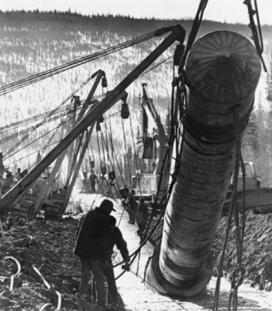 Poster of two construction workers at the Trans-Alaskan Pipeline in Alaska.
