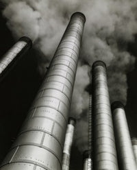Low angle view of smoke stacks poster print showcasing industrial beauty.