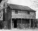 Facade of a log cabin at Fort Nashborough in Nashville, Tennessee poster print.