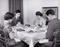 Two Young Couples Praying Before a Meal Poster Print