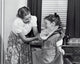 Mother Sewing Dress for Daughter Poster Print showcasing love and creativity.