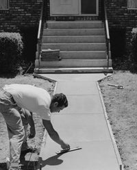 Construction worker smoothing a concrete sidewalk poster print