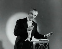 Close-up of a music conductor holding a conductor's baton poster print.