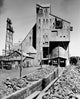 Ore being loaded from shaft to railroad cars at Calumet-Heda Copper Mine Poster Print