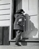 Poster print of a boy entering a house, perfect for children's decor.