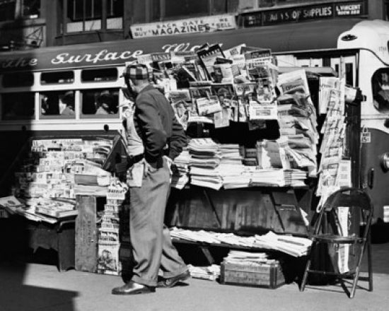 Side profile of a vendor in front of a newsstand in New York City poster print.