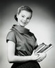 Teenage girl carrying books poster print in vibrant colors.