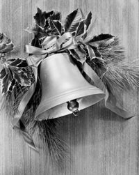 Close-up of a Christmas bell with holly leaves wall art poster print.