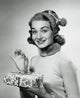 Portrait of a mid-adult woman holding a Christmas present poster print