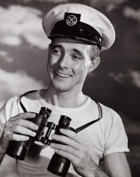 Mid adult man holding binoculars and smiling poster print.