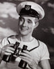 Mid adult man holding binoculars and smiling poster print.