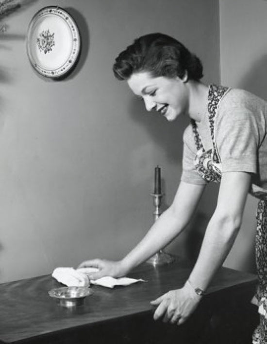 Poster print of a side profile of a young woman cleaning a table.