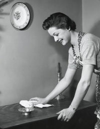 Poster print of a side profile of a young woman cleaning a table.